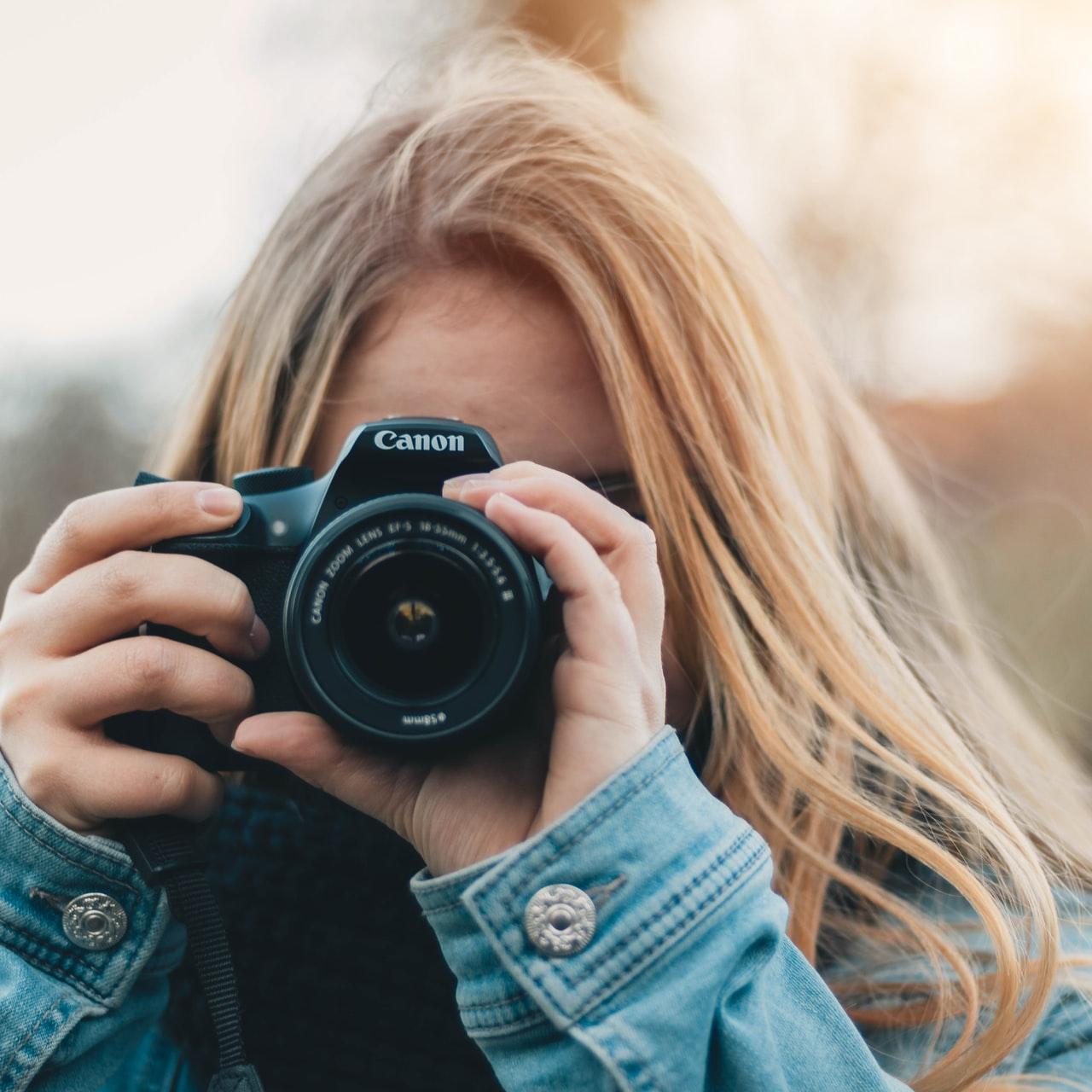 woman taking photo during daytime