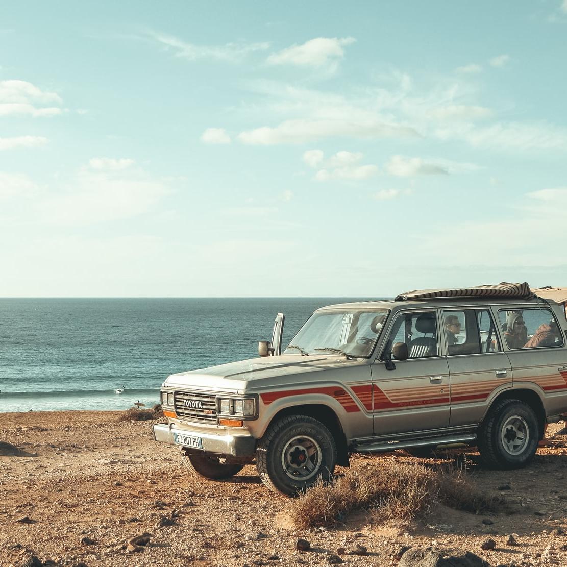 silver SUV near beach